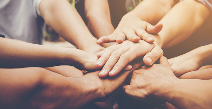 Business teamwork join hands together700